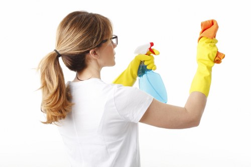 Local cleaner treating a sectional sofa in Tufnellpark